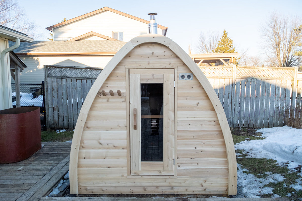 Prefabricated sauna cabin delivered and placed on a prepared site