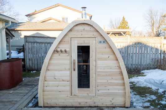 Prefabricated sauna cabin delivered and placed on a prepared site