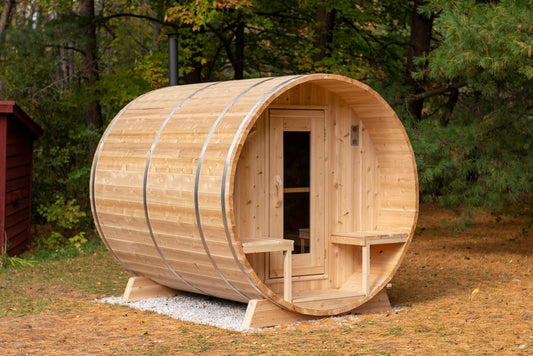 Cedar barrel sauna interior showing tiered bench seating and headroom