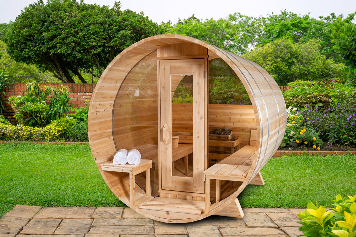 Outdoor barrel sauna with a chimney, the natural setting for a wood-burning sauna stove